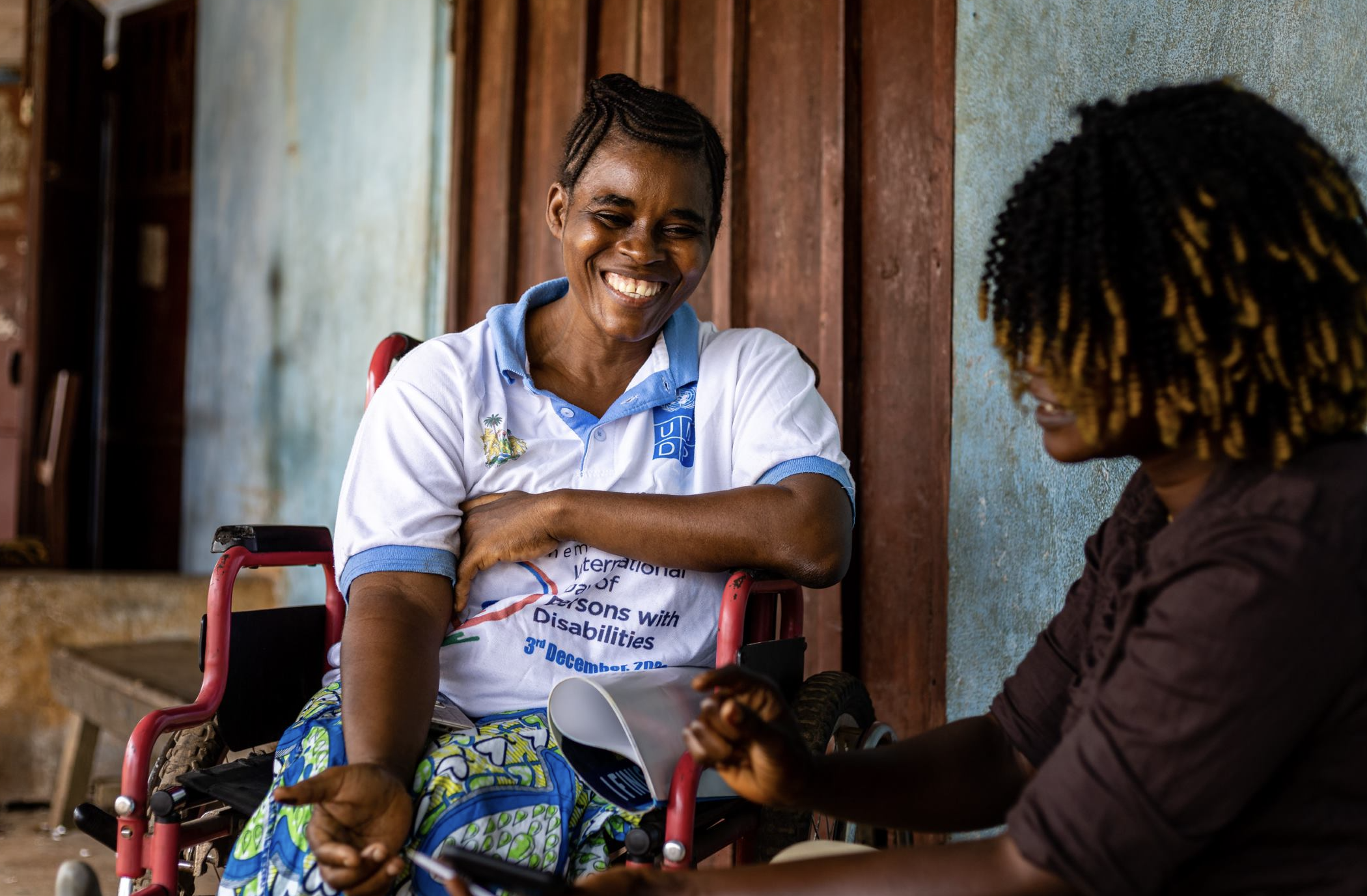 two people sat beside each other speaking