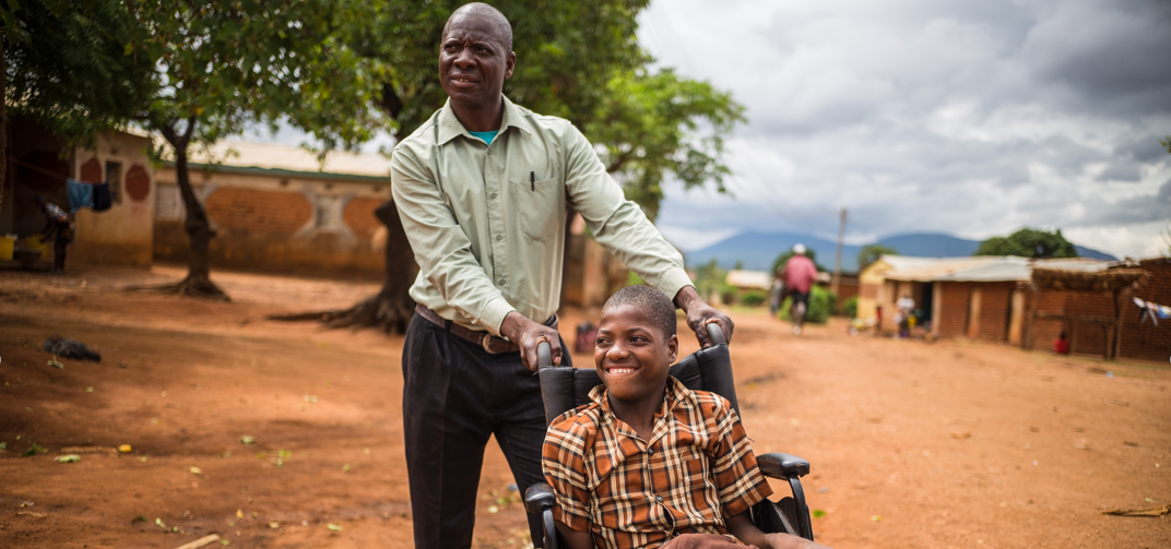 Person in a wheelchair being pushed