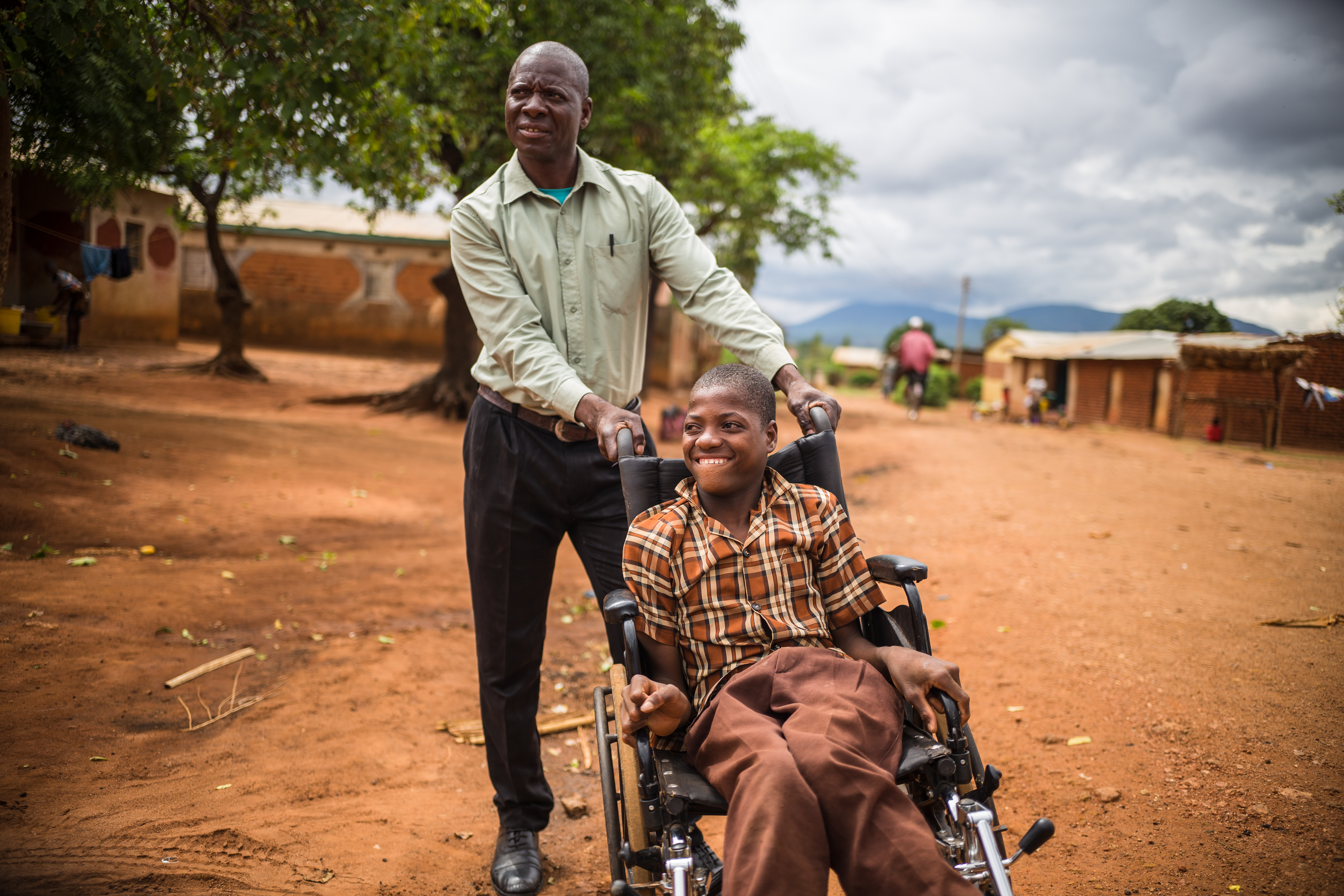 Young person being pushed in a wheelchair
